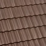 Close-up view of brown, wavy ceramic roof tiles arranged in neat, horizontal rows. The tiles have a textured surface and appear uniform and well-constructed.