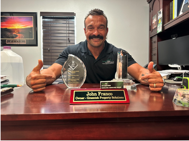 roofing company owner smiling