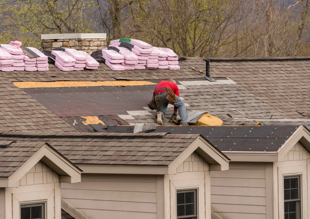 bags of shingles on a roof