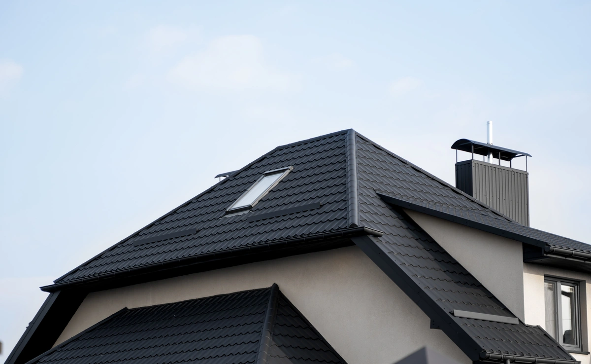 close up to black metal tile roof
