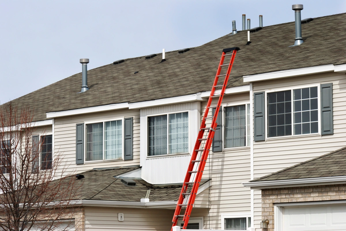 roofing contractor's ladder on roof