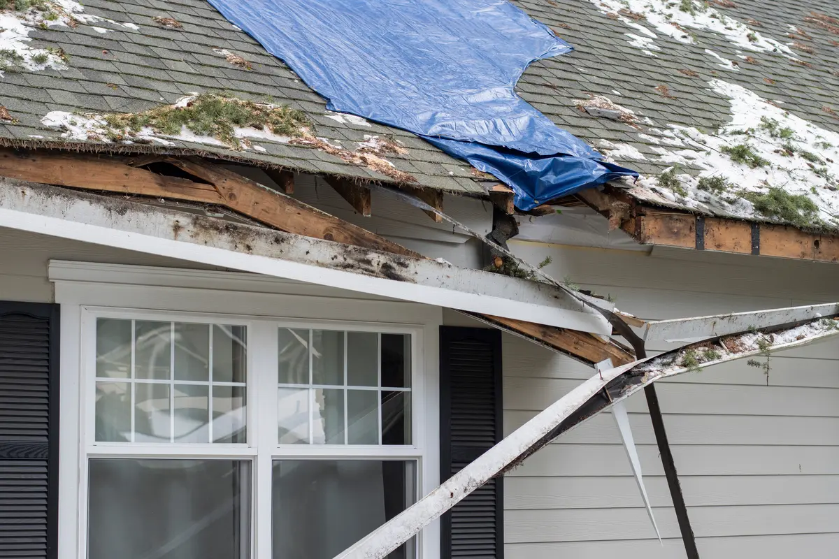 house with storm damaged roof