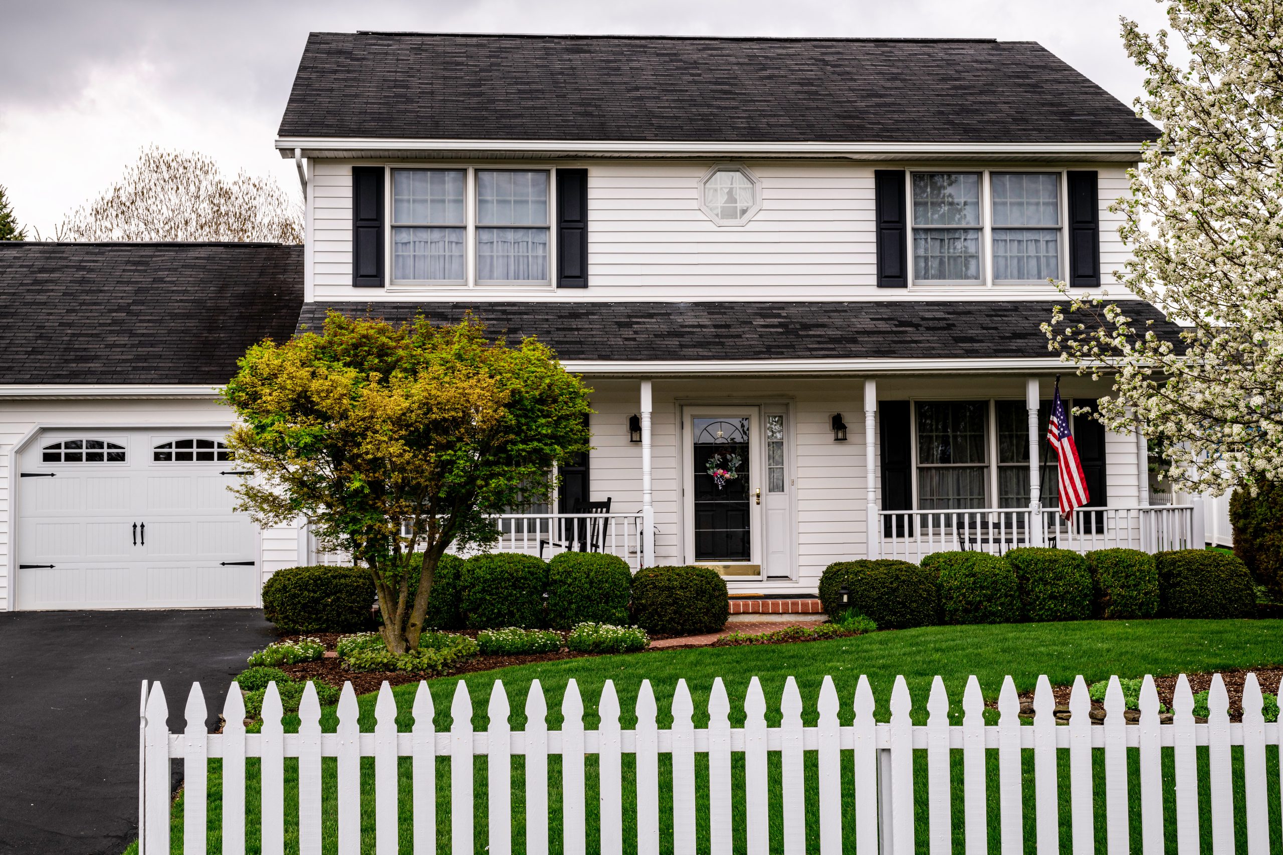 suburban house with dark asphalt roof