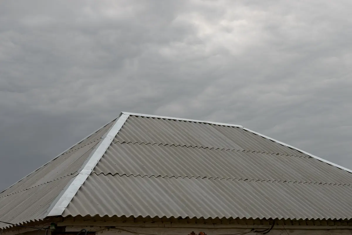 metal roof under stormy skies