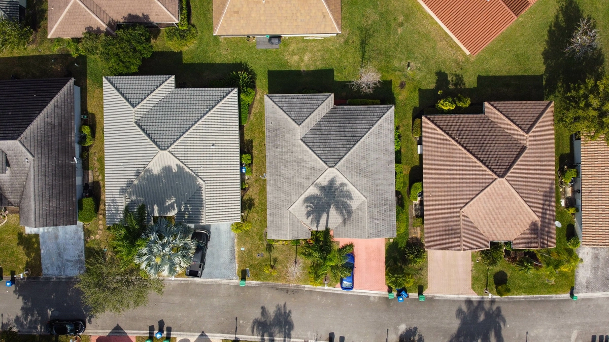 Palm tree shadows on the roof of Florida homes