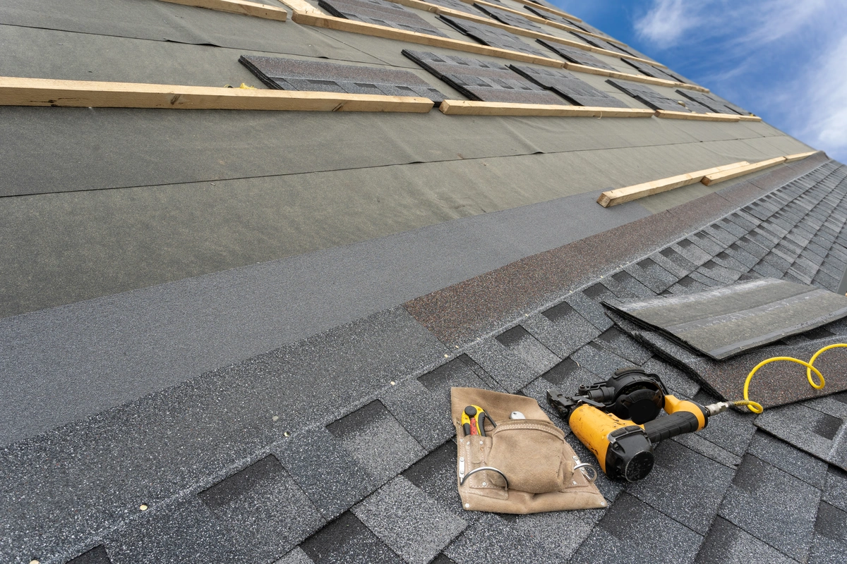 roofing tools on asphalt roof