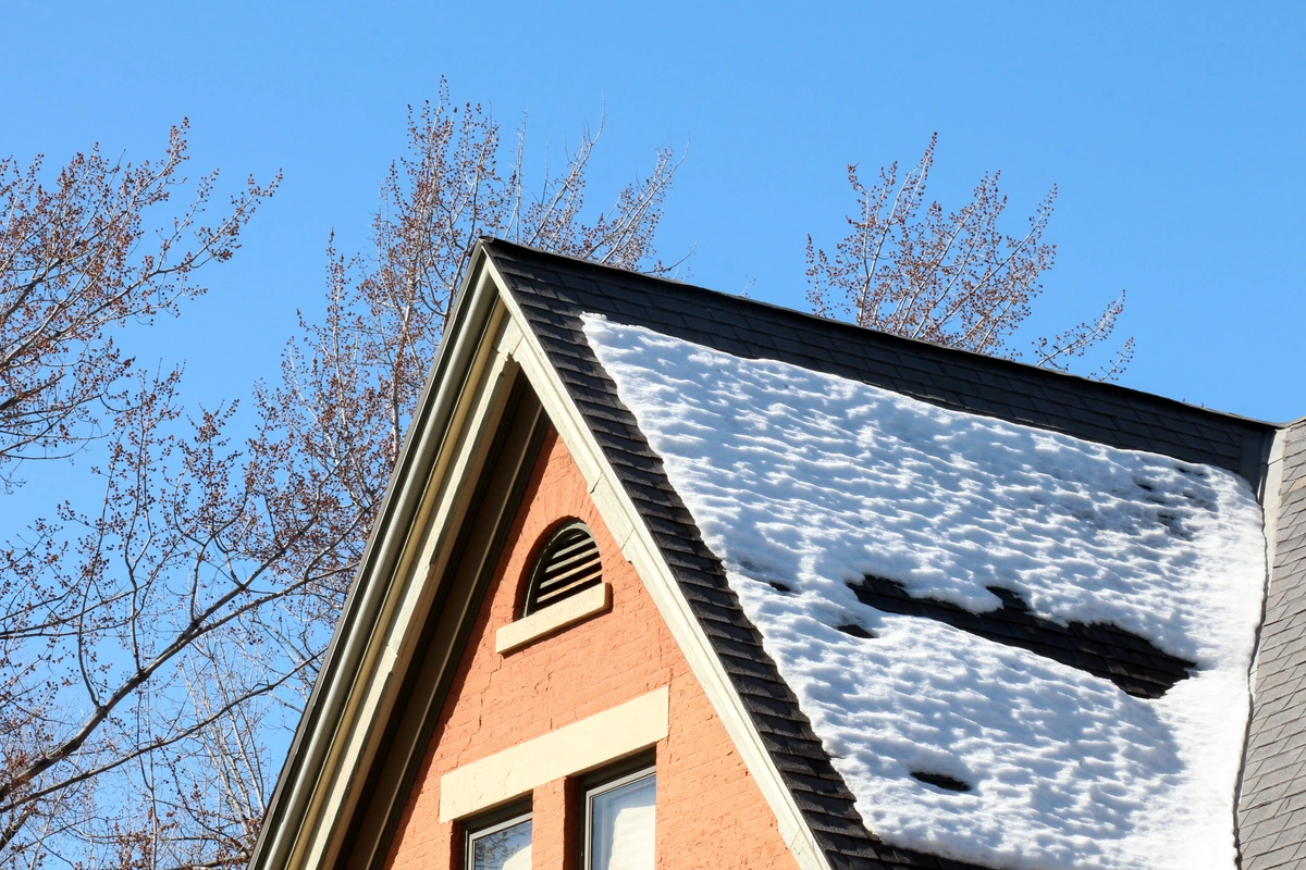 roof part with snow on shingles