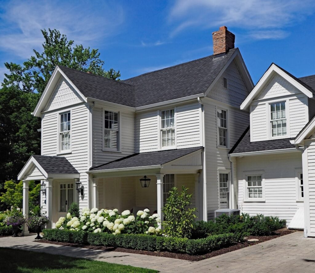 white residential house with asphalt shingles