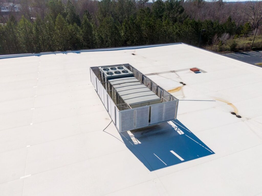commercial building tpo roofing installation winter time HVAC system