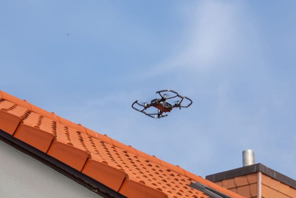 drone roof inspection close up orange tiles roof